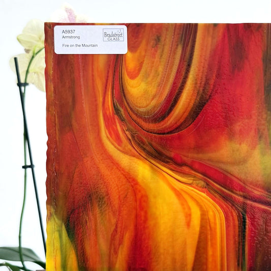 Armstrong 5937 Fire On The Mountain, Red, Yellow, Green Streaky Stained Glass Sheet. Opaque streaky art glass at Bradstreet Glass.