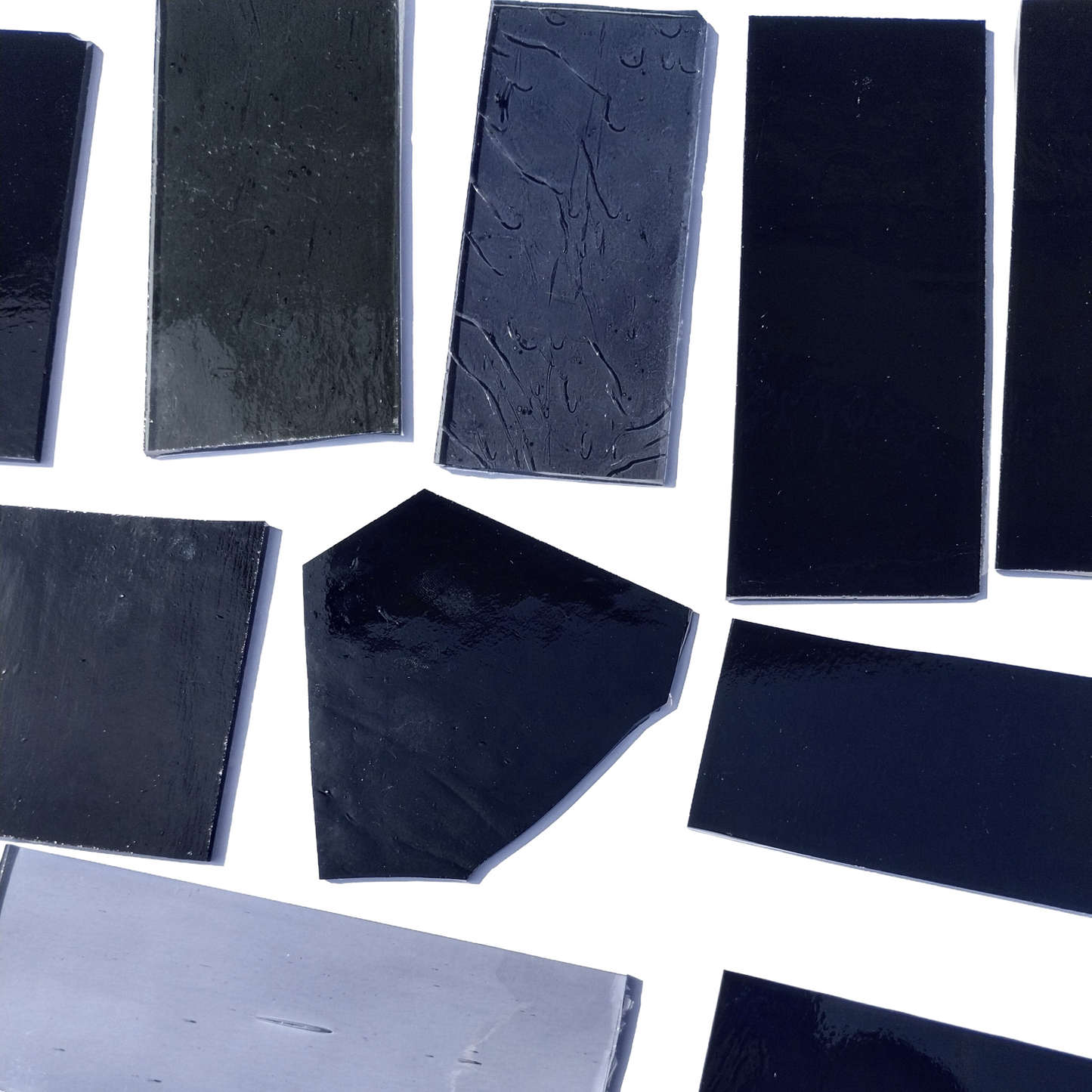 Assorted Black and Gray Stained Glass Scrap Pieces, Curated 1 lb Package. Hand picked, sorted by color, clean. Black, gray art glass assortment perfect for stained glass and mosaic art. Ships carefully in 1 business day. Free shipping available.