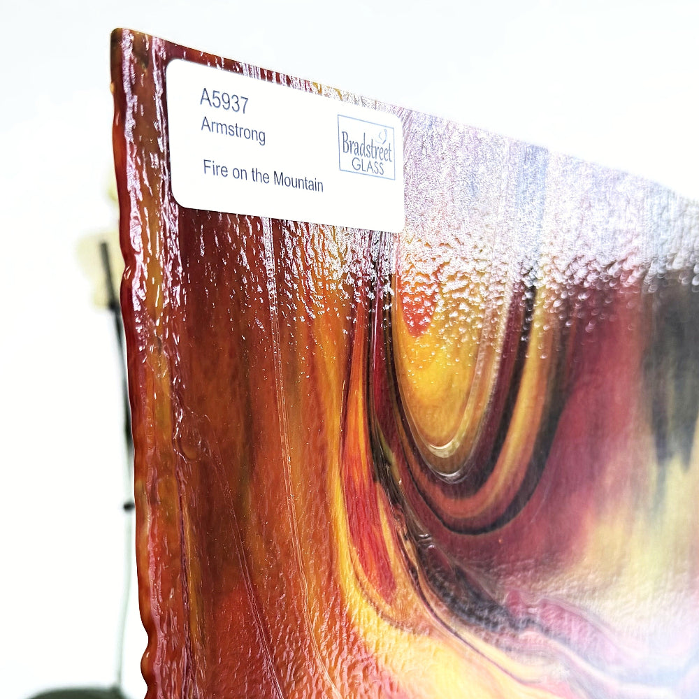 Armstrong 5937 Fire On The Mountain, Red, Yellow, Green Streaky Stained Glass Sheet. Opaque streaky art glass at Bradstreet Glass.