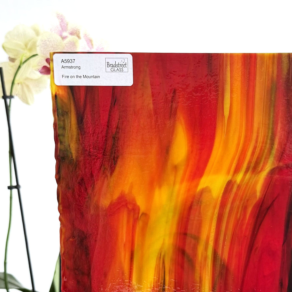 Armstrong 5937 Fire On The Mountain, Red, Yellow, Green Streaky Stained Glass Sheet. Opaque streaky art glass at Bradstreet Glass.