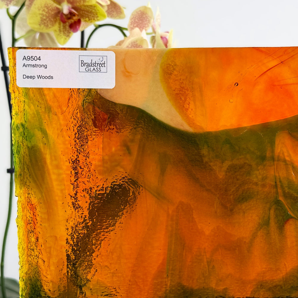 Armstrong 9504 Stained Glass Sheet Deep Woods: Dark Brown and Bright Golden Ambers with Greens. Streaky swirled art glass at Bradstreet Glass.