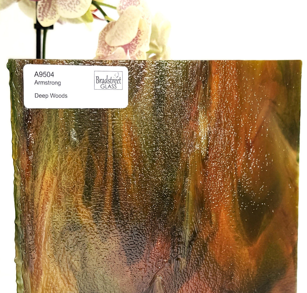 Armstrong 9504 Stained Glass Sheet Deep Woods: Dark Brown and Bright Golden Ambers with Greens. Streaky swirled art glass at Bradstreet Glass.