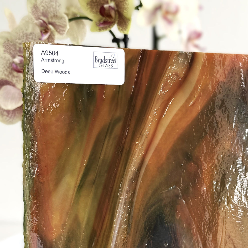 Armstrong 9504 Stained Glass Sheet Deep Woods: Dark Brown and Bright Golden Ambers with Greens. Streaky swirled art glass at Bradstreet Glass.