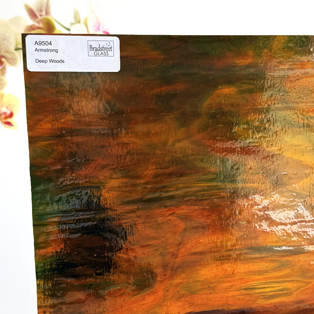 Armstrong 9504 Stained Glass Sheet Deep Woods: Dark Brown and Bright Golden Ambers with Greens. Streaky swirled art glass at Bradstreet Glass.