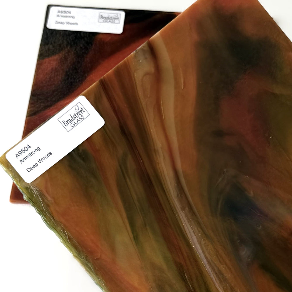 Armstrong 9504 Stained Glass Sheet Deep Woods: Dark Brown and Bright Golden Ambers with Greens. Streaky swirled art glass at Bradstreet Glass.