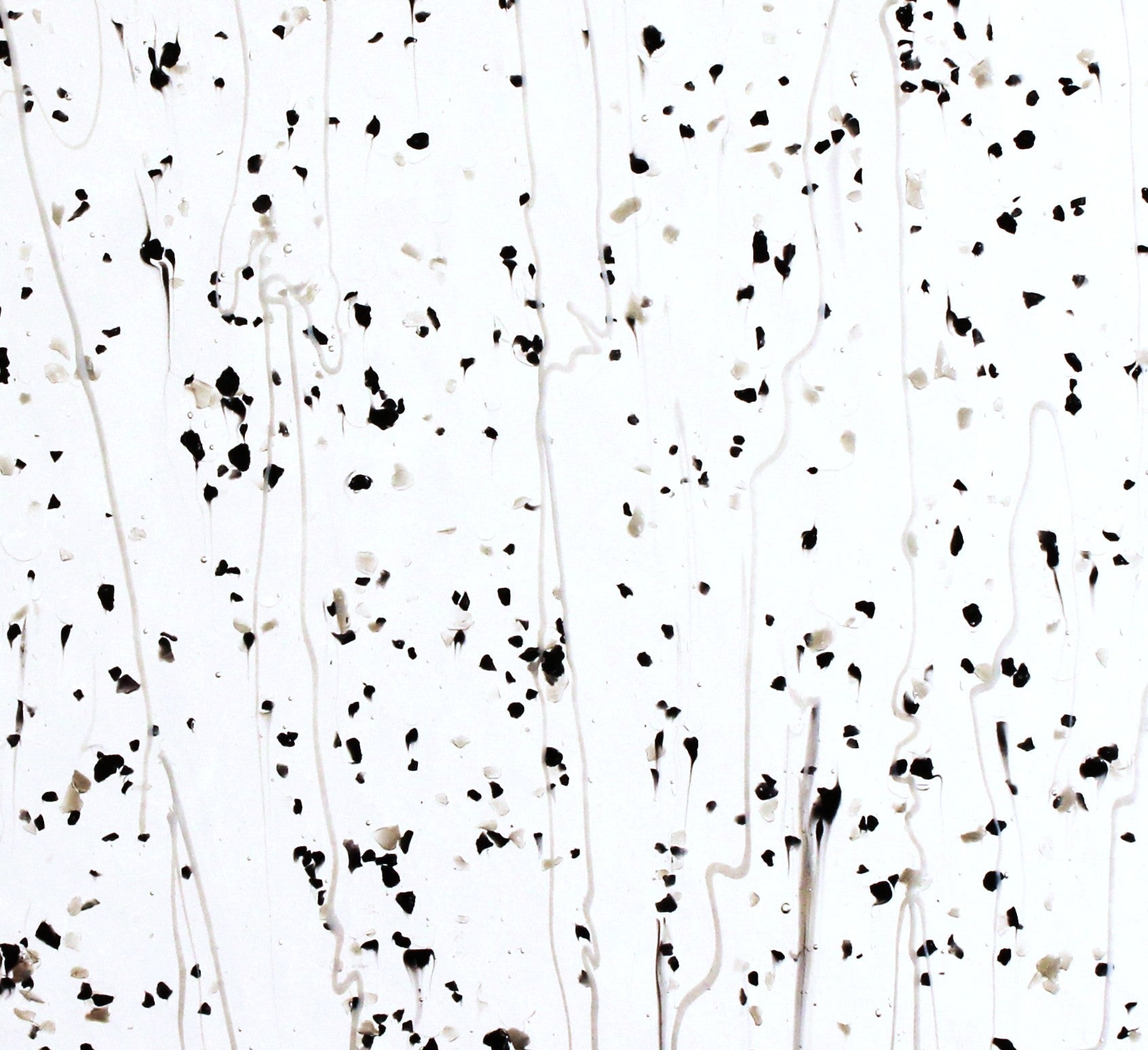 Gray & Black Frit, White Streamers on Clear Stained Glass Sheet. Bullseye 4218 Fusible 90 COE Fusible stringer glass, fusible frit glass.  Bradstreet Glass