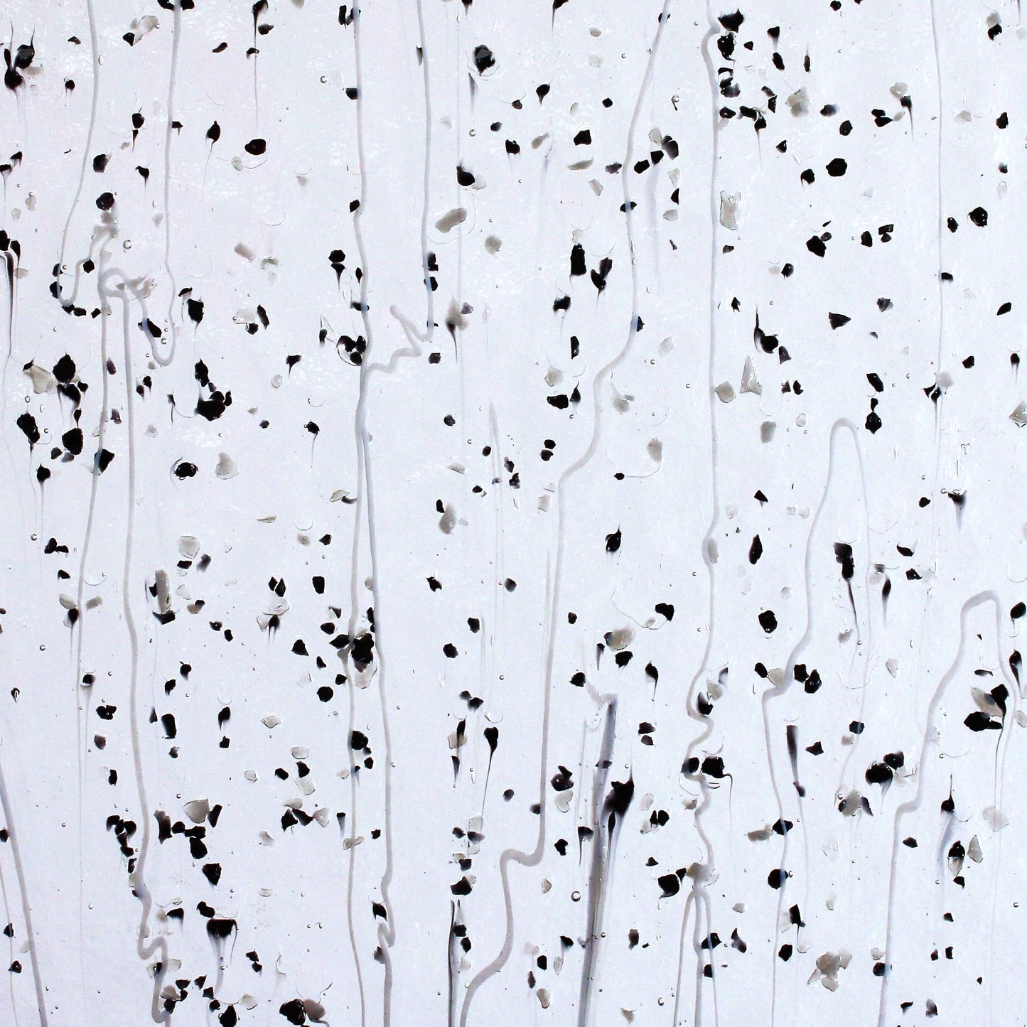 Gray & Black Frit, White Streamers on Clear Stained Glass Sheet. Bullseye 4218 Fusible 90 COE Fusible stringer glass, fusible frit glass.  Bradstreet Glass