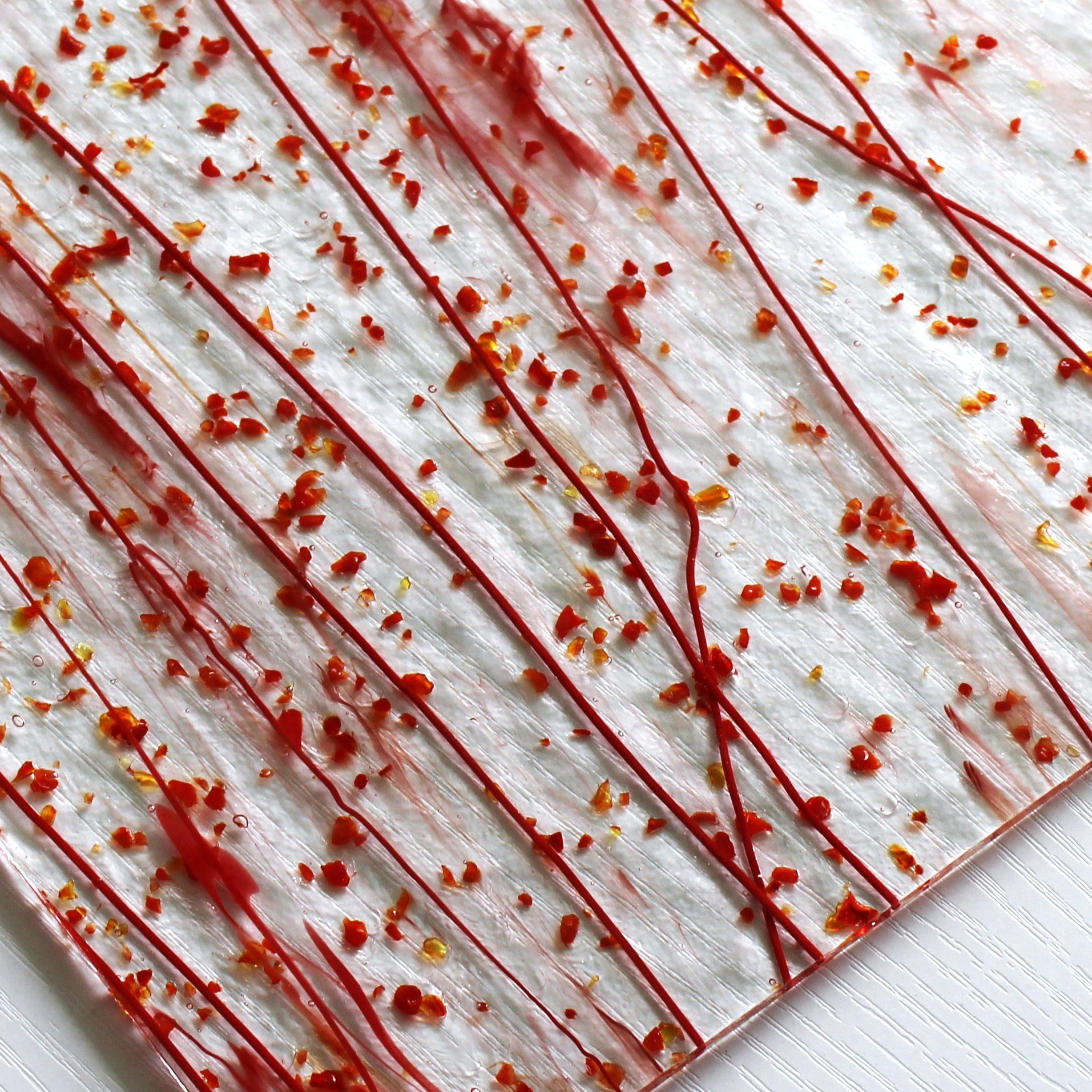 Bullseye 4224 Stained Glass sheet, red frit & red stringers on clear 90 COE fusible art glass. Bradstreet Glass