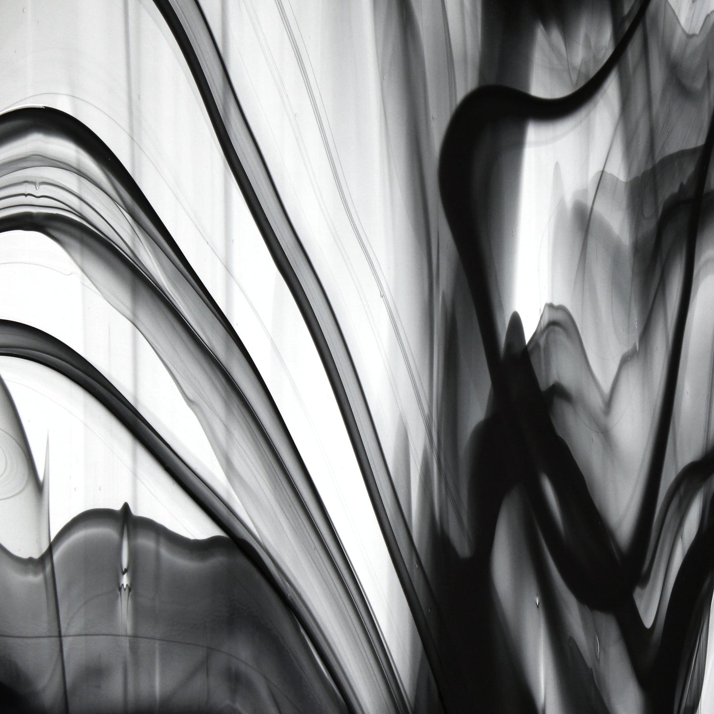 Oceanside BR400 black and clear baroque stained glass sheet showing bold irregular mixture with high-contrast pattern. Bradstreet Glass