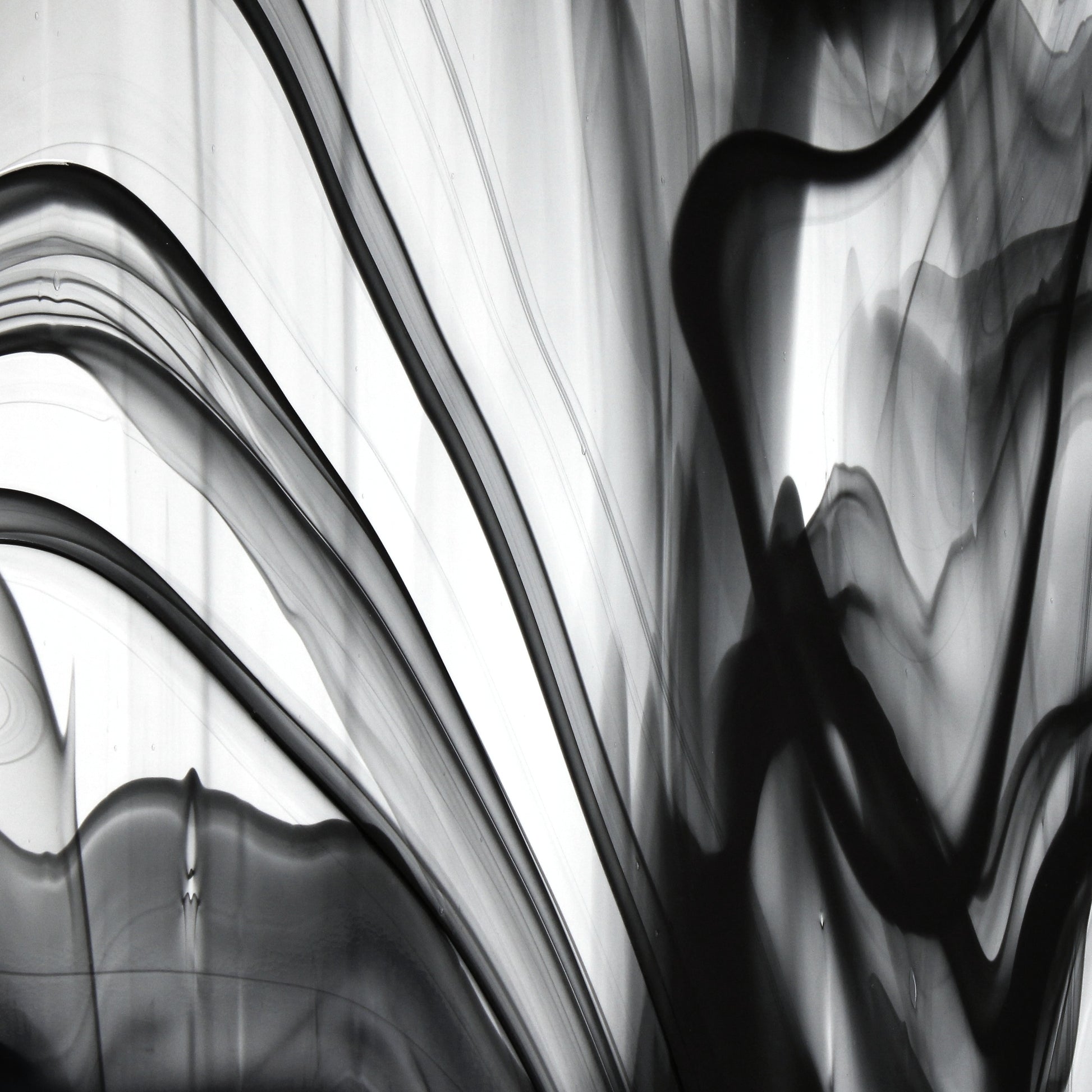 Oceanside BR400 black and clear baroque stained glass sheet showing bold irregular mixture with high-contrast pattern. Bradstreet Glass