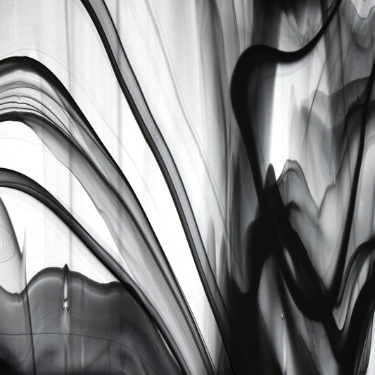 Oceanside BR400 black and clear baroque stained glass sheet showing bold irregular mixture with high-contrast pattern. Bradstreet Glass