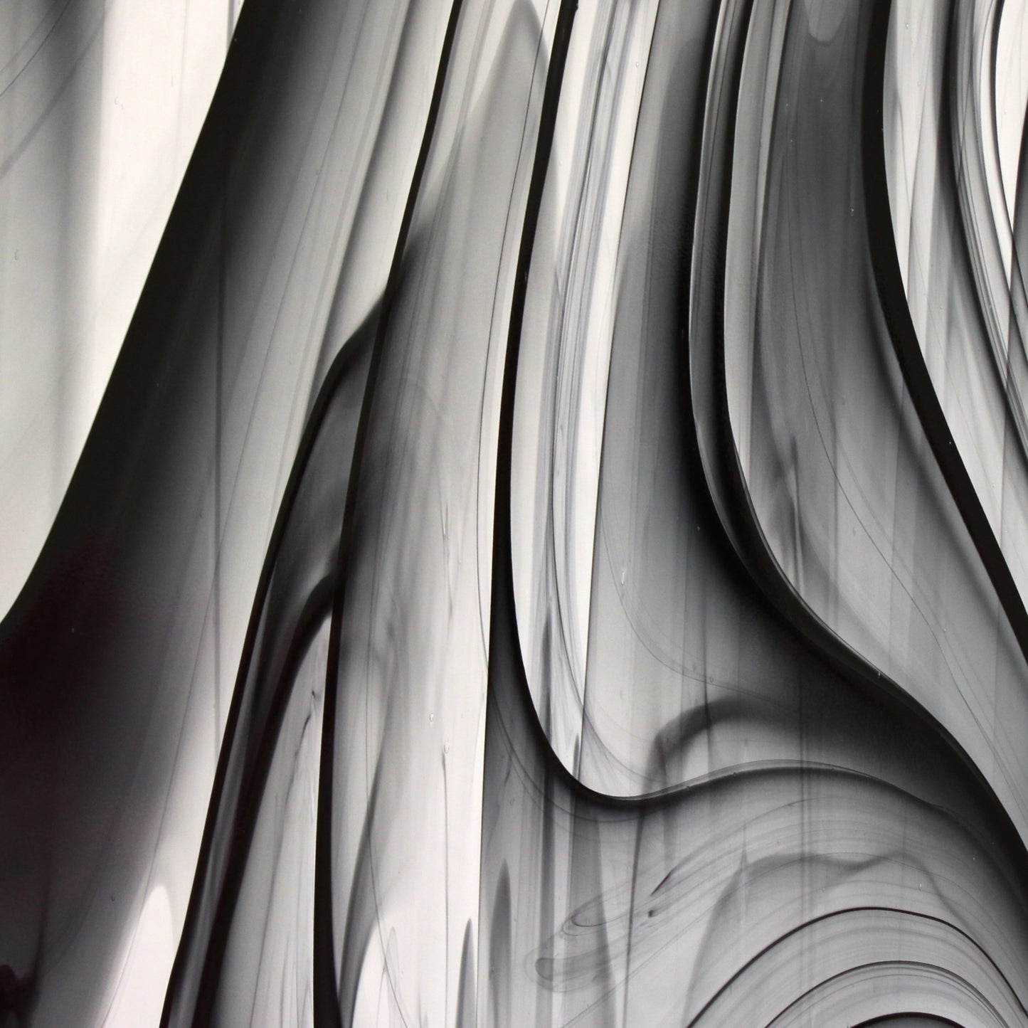 Oceanside BR400 black and clear baroque stained glass sheet showing bold irregular mixture with high-contrast pattern. Bradstreet Glass