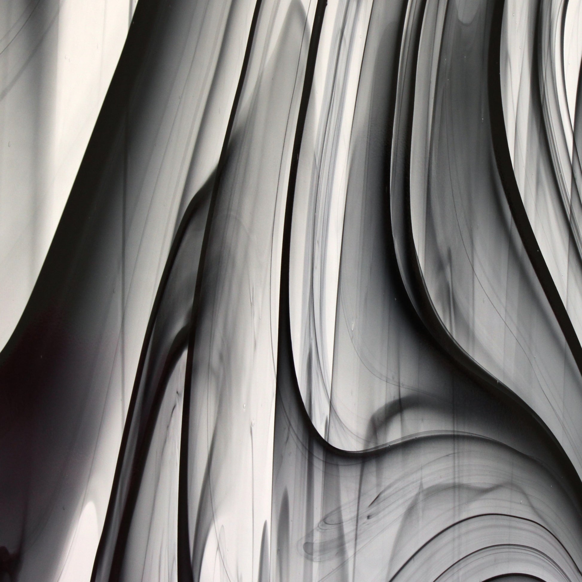 Oceanside BR400 black and clear baroque stained glass sheet showing bold irregular mixture with high-contrast pattern. Bradstreet Glass