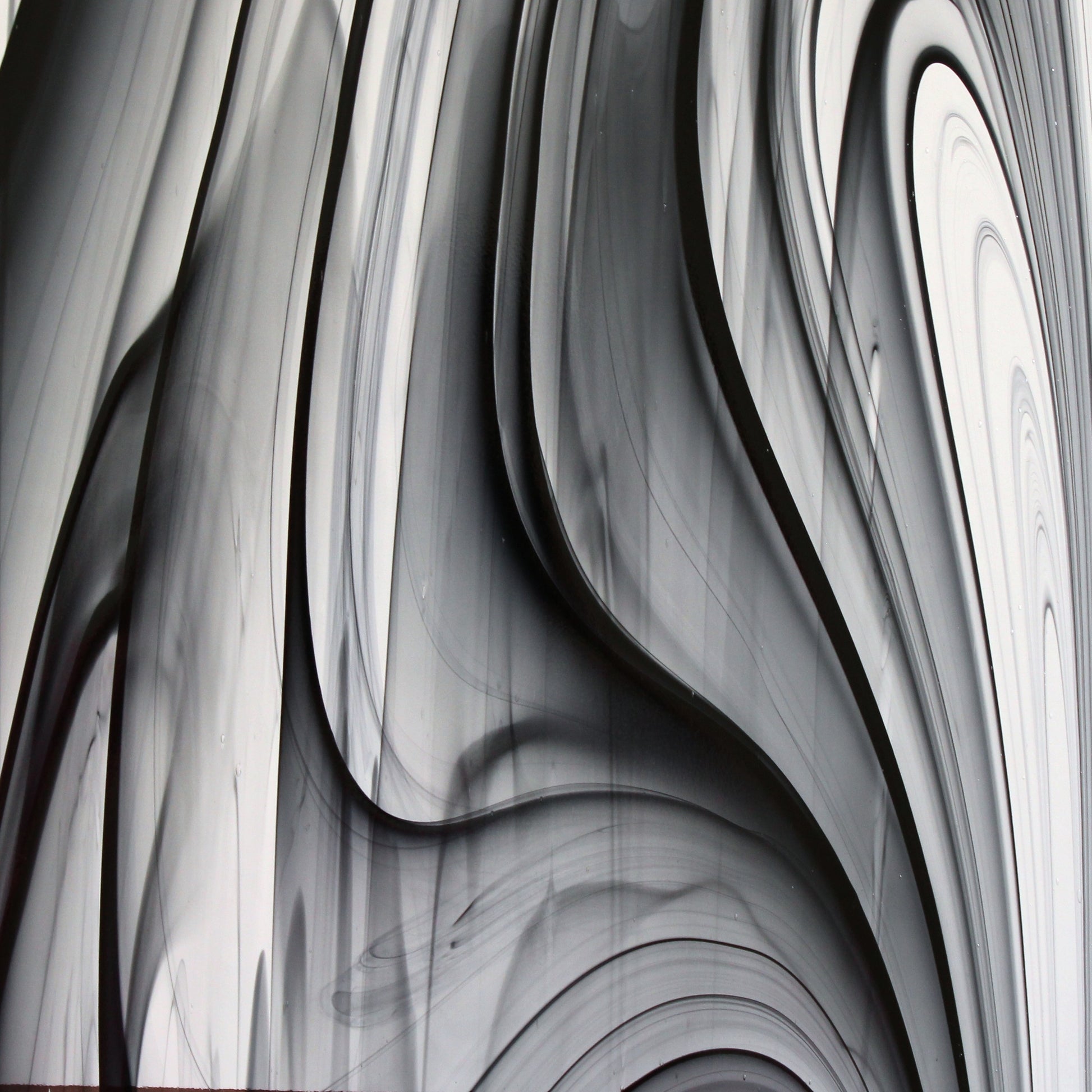 Oceanside BR400 black and clear baroque stained glass sheet showing bold irregular mixture with high-contrast pattern. Bradstreet Glass