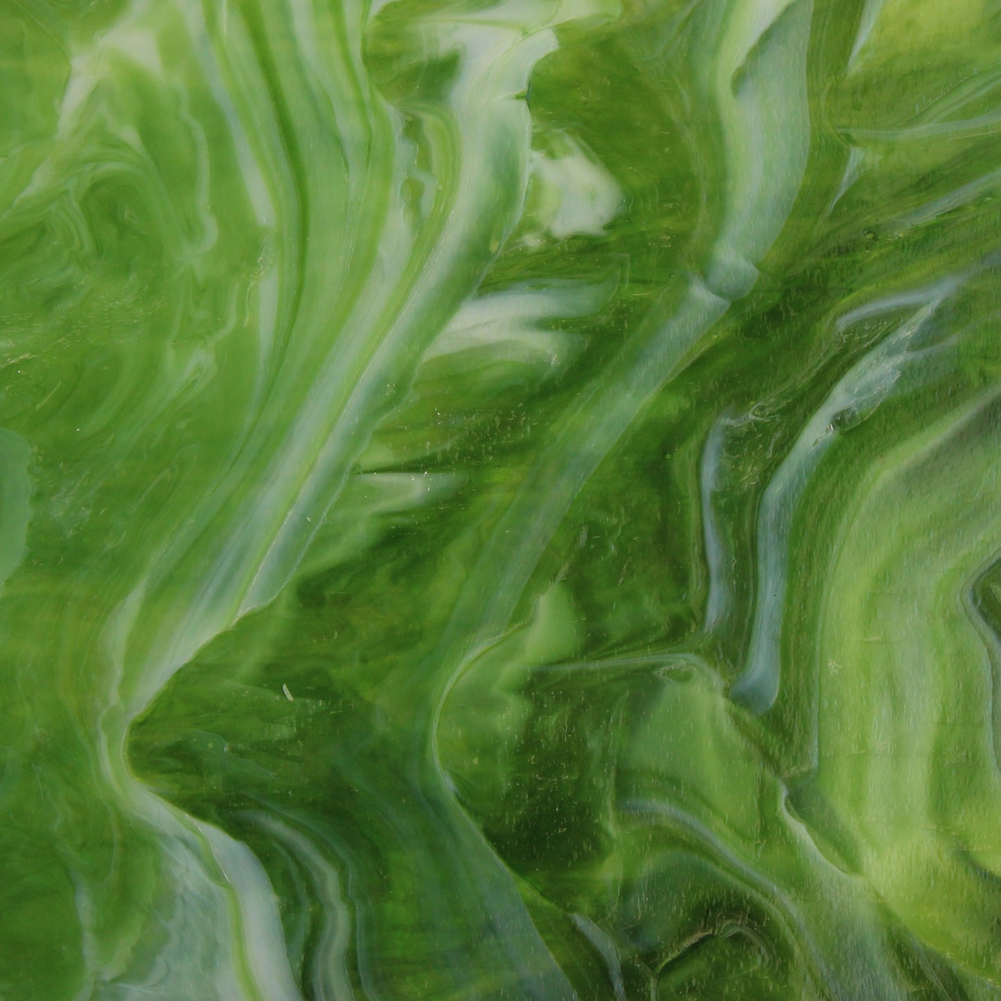 Dark Green Wispy Opal Iridized Stained Glass Sheet Wissmach WO101IR Green Swirled Iridescent Art Glass at Bradstreet Glass