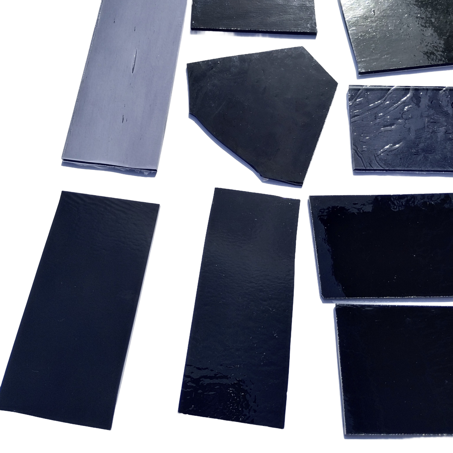 Assorted Black and Gray Stained Glass Scrap Pieces, Curated 1 lb Package. Hand picked, sorted by color, clean. Black, gray art glass assortment perfect for stained glass and mosaic art. Ships carefully in 1 business day. Free shipping available.
